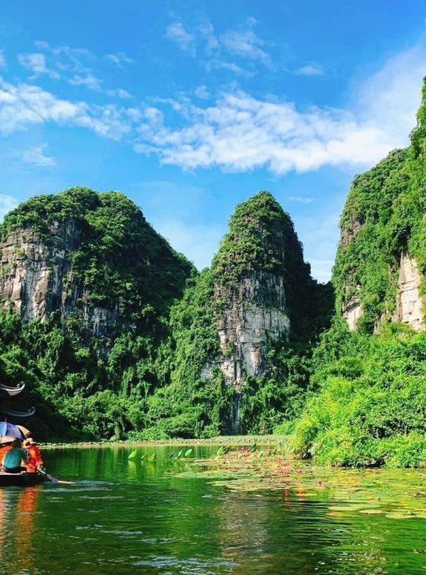 Scenic Lan Ha Bay landscape with lush green karst mountains and tranquil waters, perfect for a luxur.