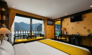Stunning view of Halong Bay from a cruise balcony with elegant interior design, perfect for a luxuri.
