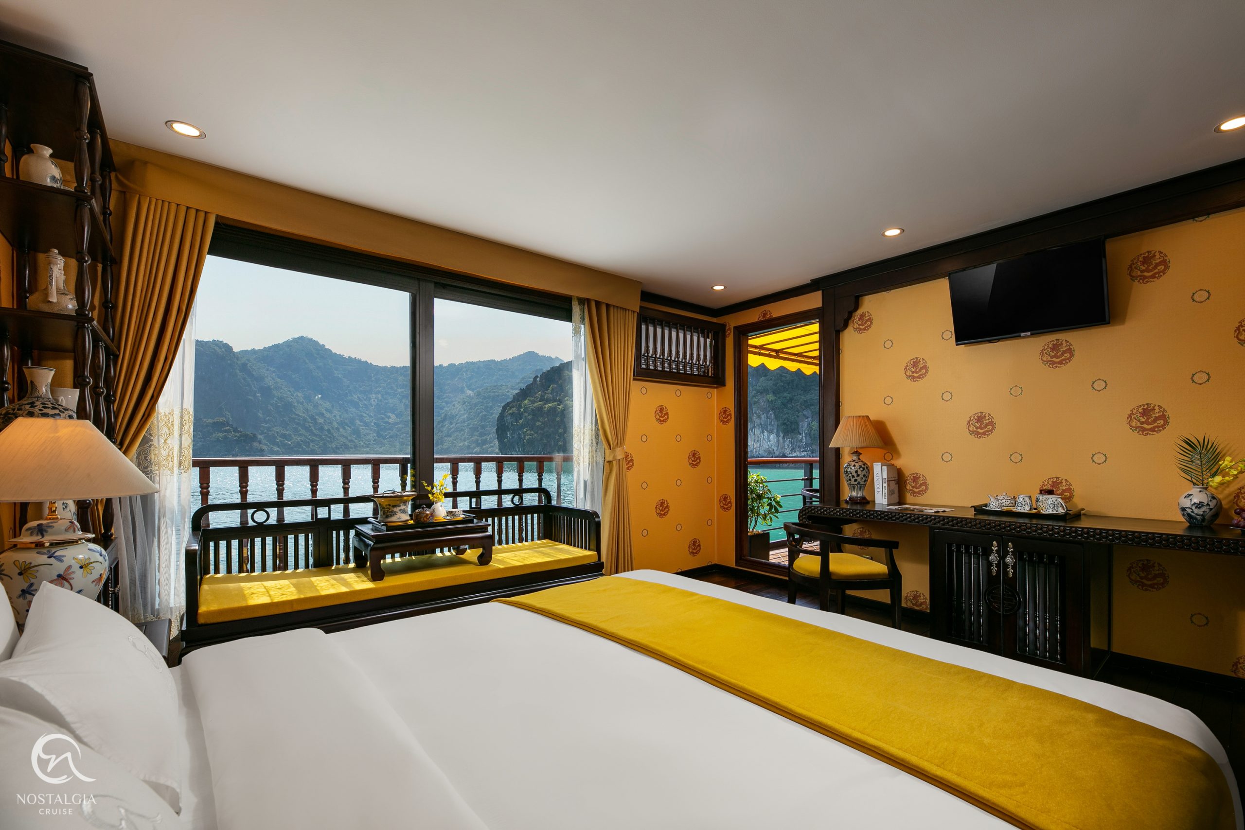Stunning view of Halong Bay from a cruise balcony with elegant interior design, perfect for a luxuri.