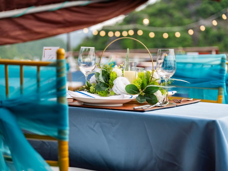 Elegant dining setup on a Halong Bay cruise with scenic views and sophisticated ambiance.