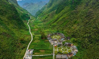 Ha Giang Loop Tour - Breathtaking mountain village landscape with lush greenery and winding roads in Vietnam, perfect for.