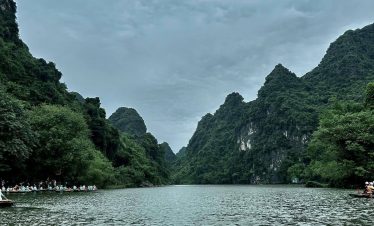 Stunning Lan Ha Bay landscape featuring towering limestone karsts and tranquil waters, perfect for a.