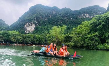 Kayaking adventure in Lan Ha Bay with stunning limestone cliffs and lush greenery, perfect for natur.