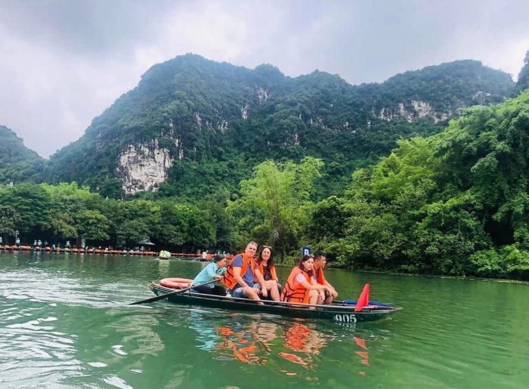 Kayaking adventure in Lan Ha Bay with stunning limestone cliffs and lush greenery, perfect for natur.
