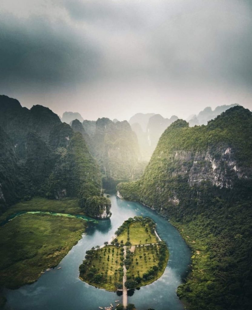 Stunning Lan Ha Bay landscape with lush green islands and calm waters, perfect for a luxurious cruis.