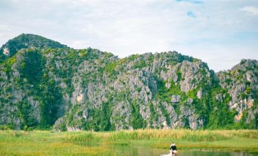 Scenic Sapa mountain landscape with trekking activity and vibrant natural surroundings.