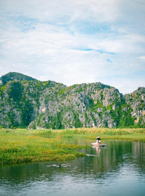 Scenic Sapa mountain landscape with trekking activity and vibrant natural surroundings.