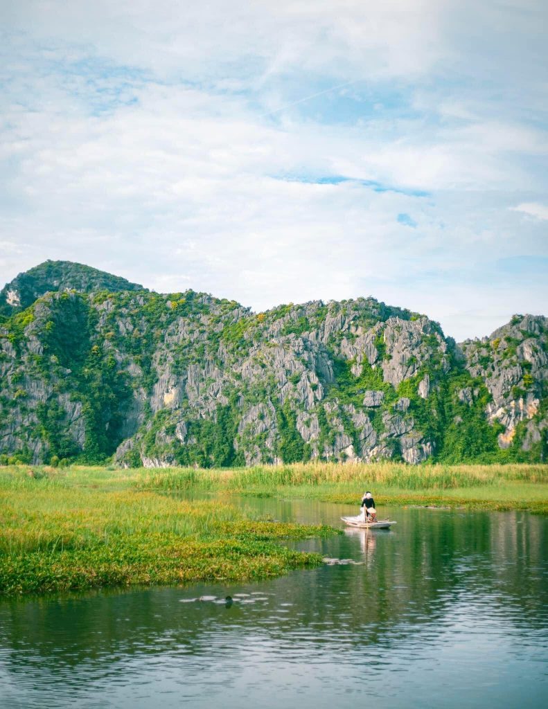 Scenic Sapa mountain landscape with trekking activity and vibrant natural surroundings.