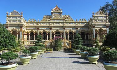 Stunning view of a Vietnamese palace showcasing ornate design and vibrant surroundings, perfect for.