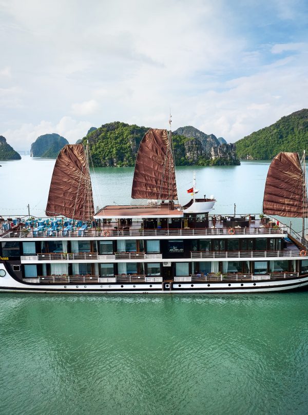 A luxurious Lan Ha Bay cruise showcasing stunning limestone karsts and tranquil waters.