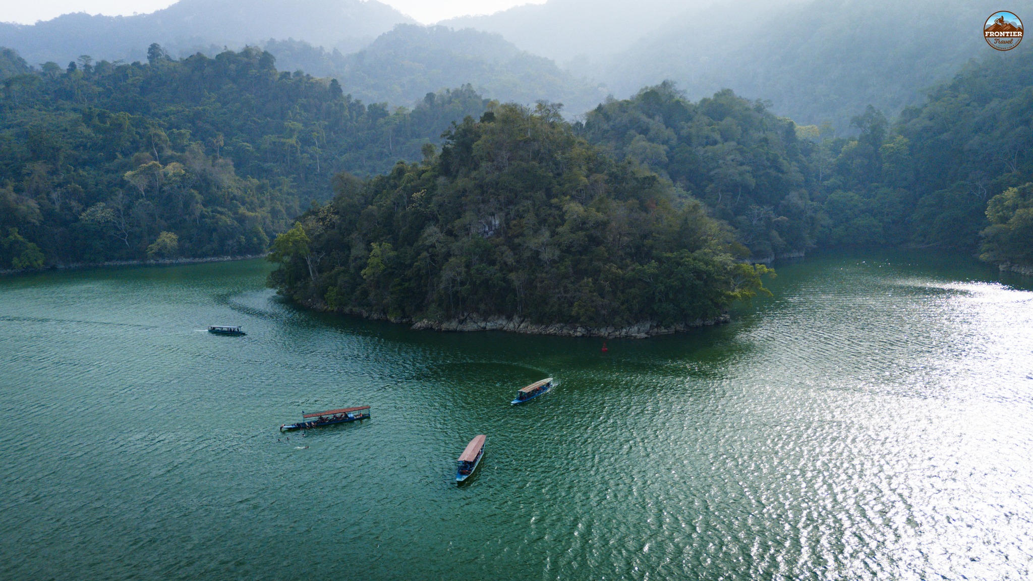 Beautiful Halong Bay landscape with boats and emerald waters, perfect for cruising and exploring sce.