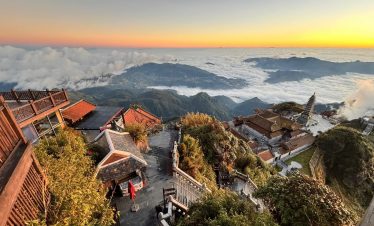 Majestic mountain landscape with lush greenery and vibrant sunset colors in Sapa.