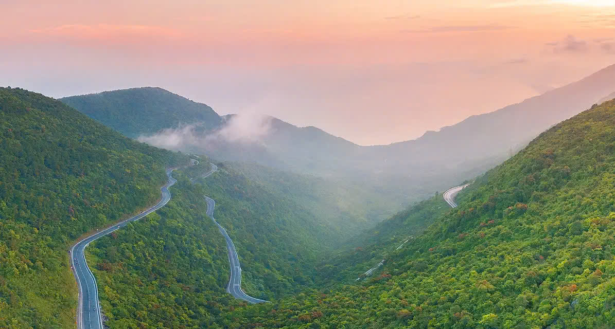 hai-van-pass-winding-road-mountain-scenery-sunset-viettrendtour