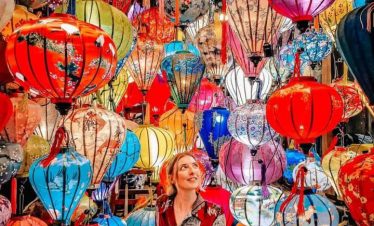 Vibrant lantern scene in Vietnam showcasing traditional craftsmanship and lively market atmosphere.