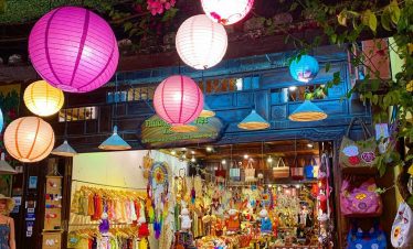 Vibrant night market in Vietnam with colorful lanterns, local crafts, and lively atmosphere perfect.