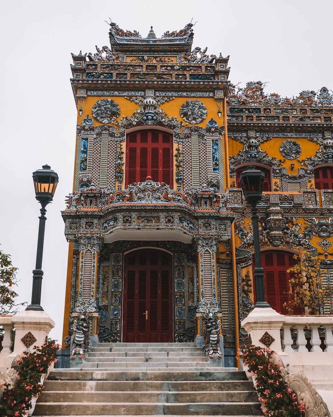Colorful Hue Imperial Palace architecture with intricate details and vibrant yellow accents.