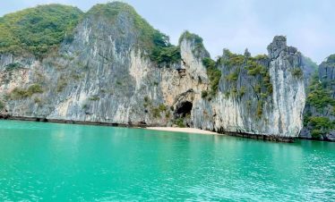 Stunning Lan Ha Bay scenery with turquoise waters and towering limestone cliffs, perfect for a luxur.
