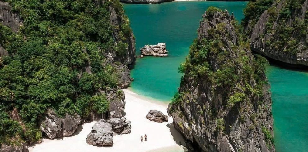 Breathtaking view of Lan Ha Bay's turquoise waters and limestone islands from a luxury cruise balcon.