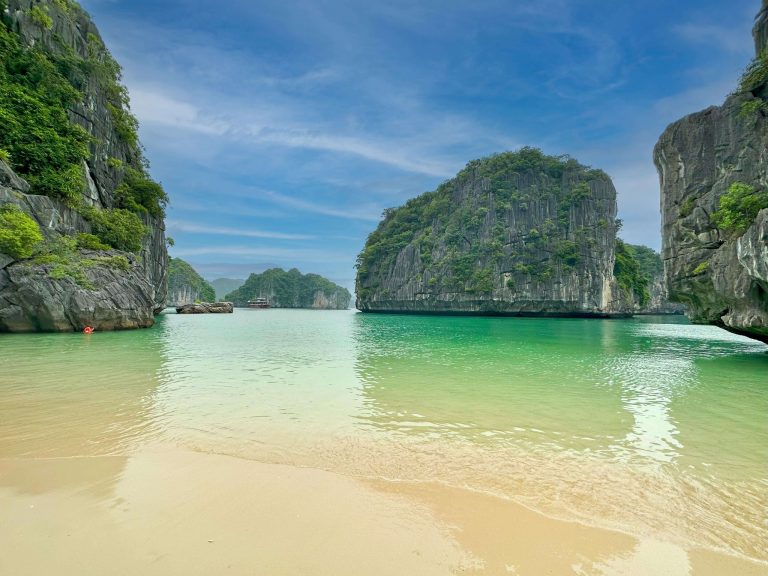 Stunning view of Halong Bay's emerald waters and towering limestone islands, perfect for kayaking an.