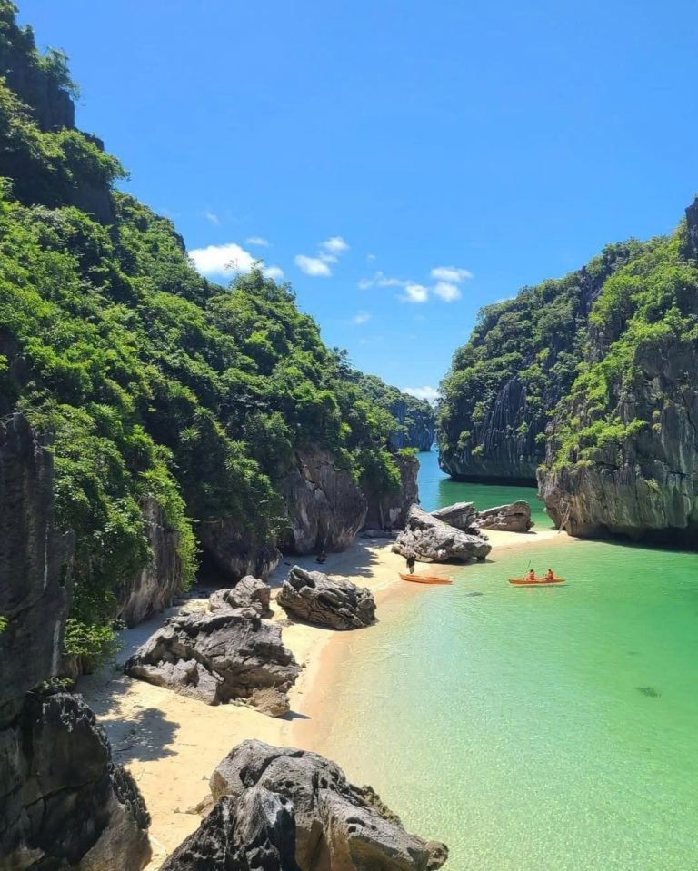 Stunning Halong Bay cruise balcony scene with limestone cliffs and tranquil emerald waters, perfect.