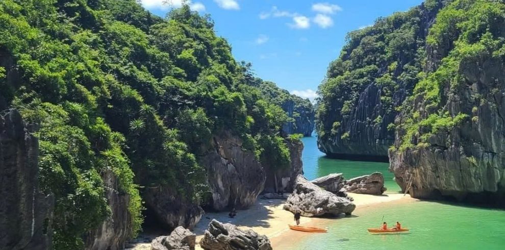 Stunning Halong Bay cruise balcony scene with limestone cliffs and tranquil emerald waters, perfect.
