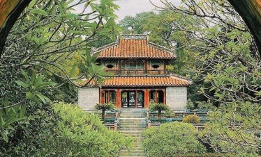 Serene temple scene framed by vibrant greenery, showcasing Vietnam's rich cultural heritage and tran.