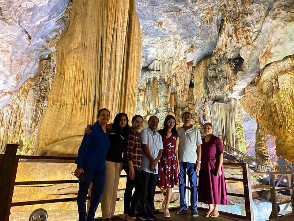 Vivid scene of tourists exploring stunning limestone caves in Halong Bay, showcasing adventure and n.