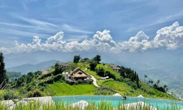 Stunning mountain landscape with lush greenery and traditional village views in Sapa.