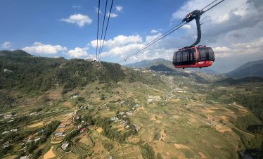Stunning view of Sapa's lush mountains from a cable car, offering a peaceful and breathtaking trekki.