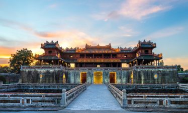 Majestic Hue Imperial Palace at sunset, showcasing traditional Vietnamese architecture and cultural.