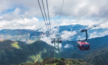 Stunning view of Sapa mountains from cable car, capturing the majestic landscape and serene atmosphe.