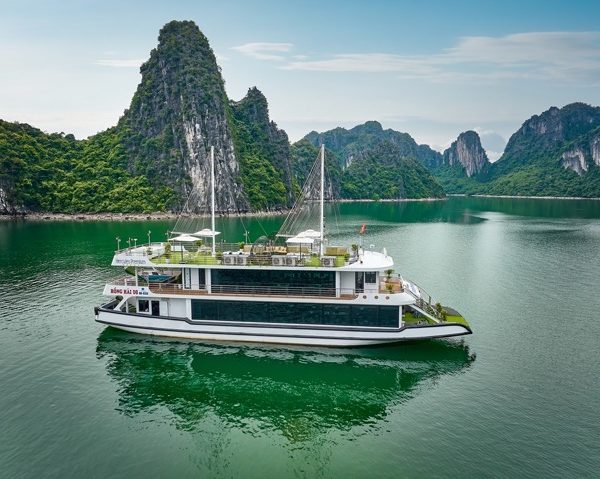Stunning Halong Bay cruise with towering limestone karsts and emerald waters, perfect for a luxuriou.