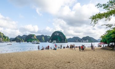 Stunning Halong Bay scenery with boats and limestone islands, perfect for a memorable cruise adventu.