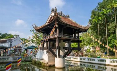 Scenic view of a historic Vietnamese temple with traditional architecture and lush greenery, perfect.