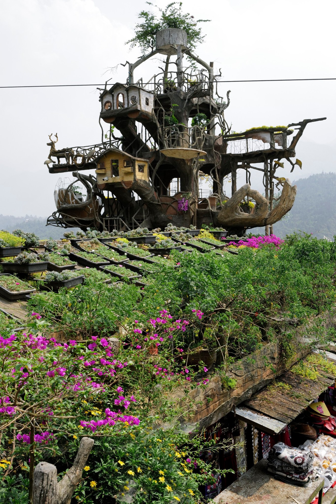 Colorful treehouse complex with whimsical design in lush greenery, perfect for adventure and cultura.