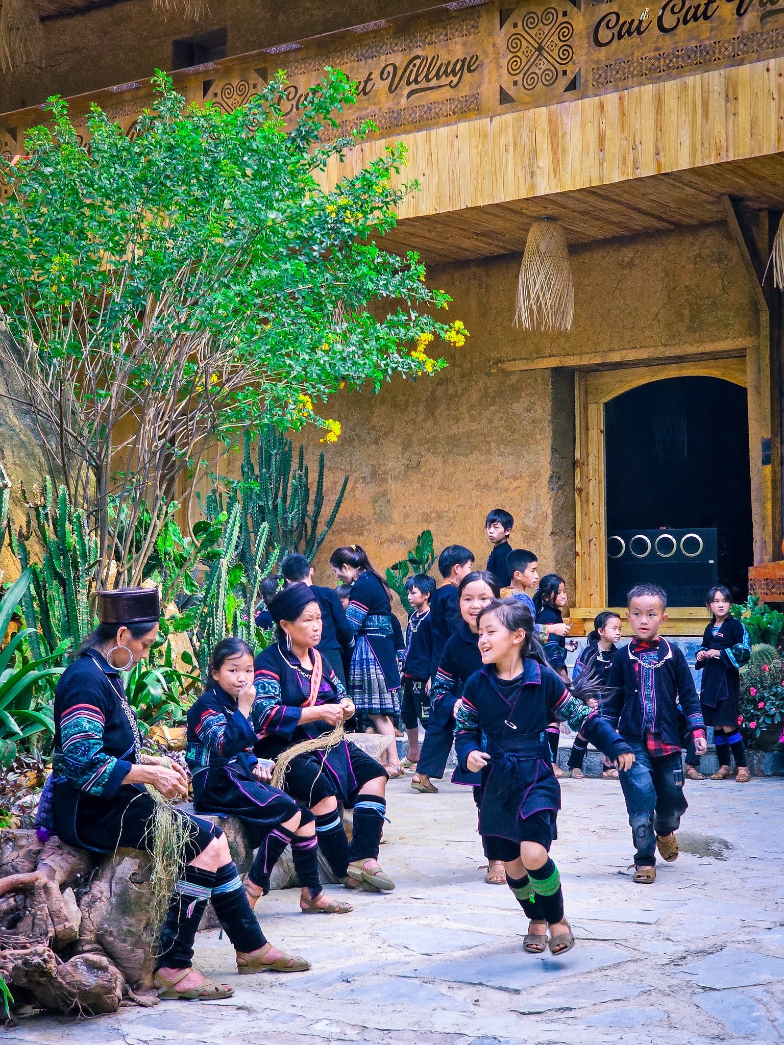 Vibrant scene of local villagers in traditional attire performing cultural dance at a Vietnam ethnic.