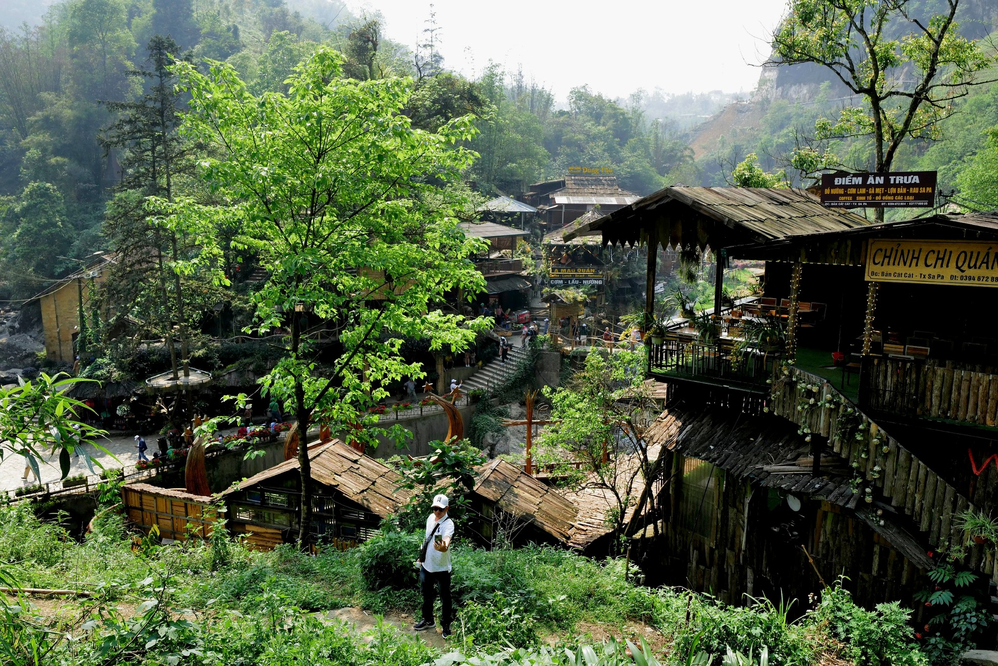 Scenic trekking through lush Vietnamese village landscapes with vibrant greenery and traditional woo.