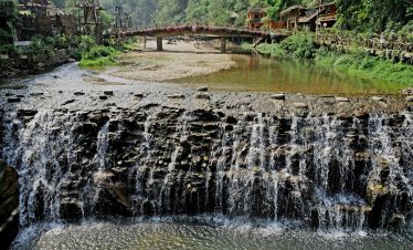 Stunning waterfall scene in Sapa showcasing lush greenery and cascading waters, perfect for trekking.