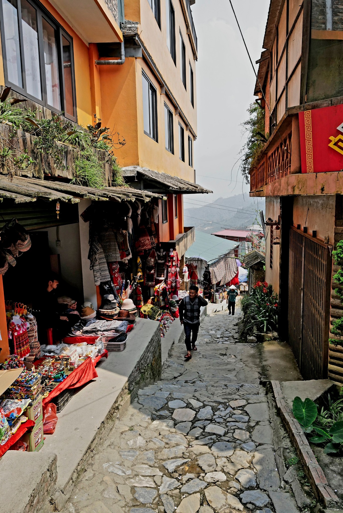 Charming Sapa village street with local shops and mountain views, perfect for cultural immersion and.