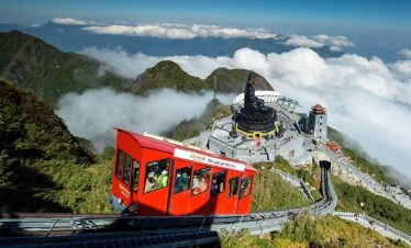 Cable car ride over lush mountains in Vietnam, offering breathtaking views and a sense of adventure.