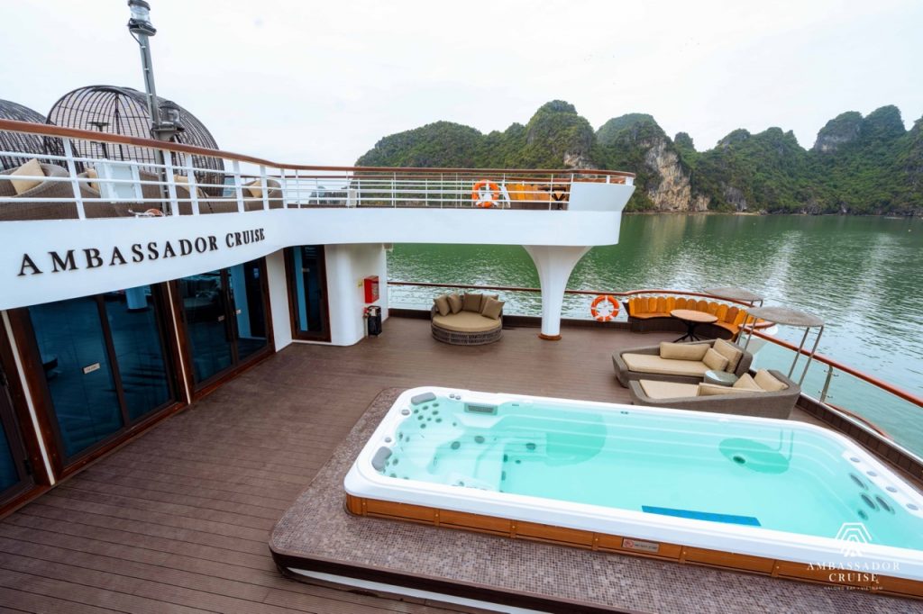Relaxing cruise balcony with hot tub and seating on Halong Bay, Vietnam.
