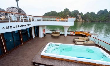 Relaxing cruise balcony with hot tub and seating on Halong Bay, Vietnam.