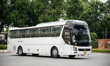 Modern bus for Halong Bay cruise transfer.