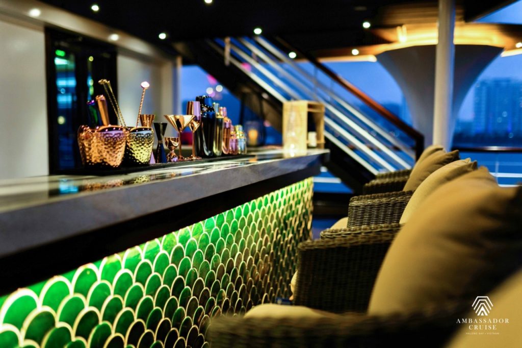 Relaxing cruise lounge with modern decor and scenic views of Halong Bay.