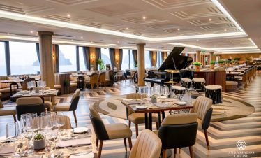 Luxurious cruise balcony scene in Halong Bay with scenic water views and relaxing atmosphere.