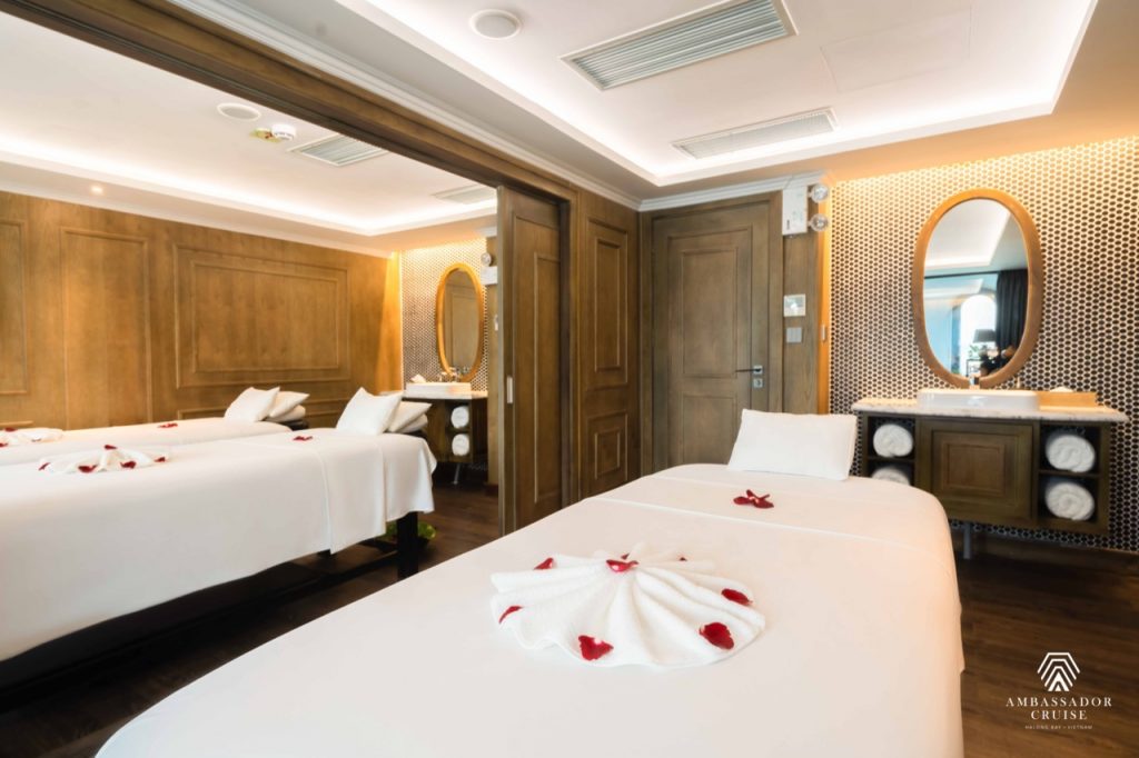 Beautiful hotel room with elegant decor and romantic rose petal arrangements.