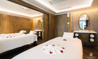 Beautiful hotel room with elegant decor and romantic rose petal arrangements.