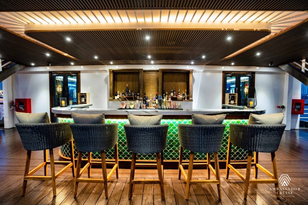 Halong Bay cruise bar with modern design and ambient lighting, perfect for relaxing and enjoying sce.