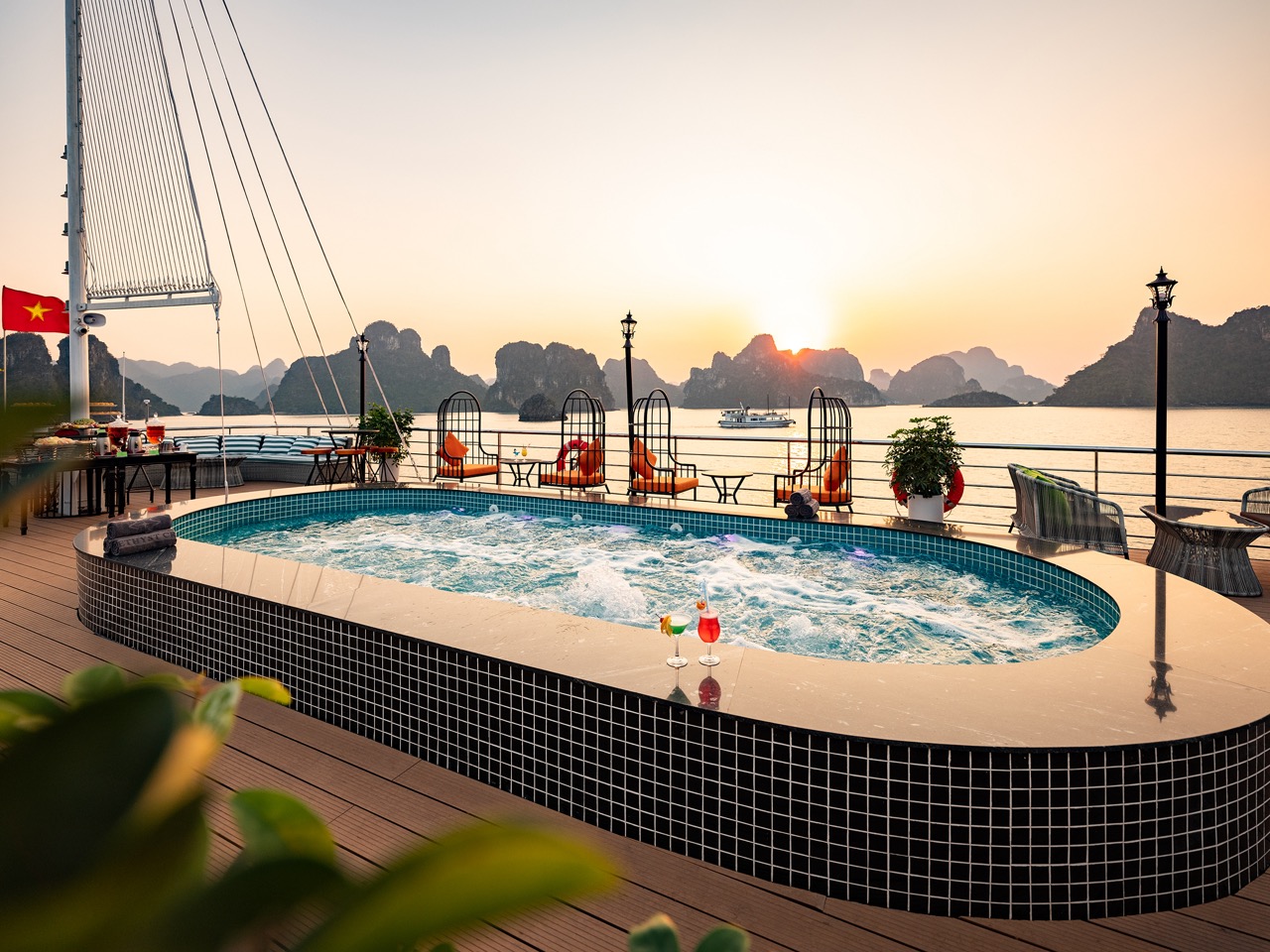amethyst-day-cruise-sundeck-jacuzzi-sunset-golden-hour-halong-bay-viettrendtour