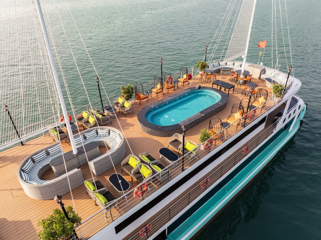 Stunning Halong Bay cruise balcony with panoramic views and luxurious amenities.